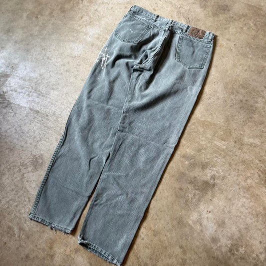 Distressed Green Wrangler Jeans