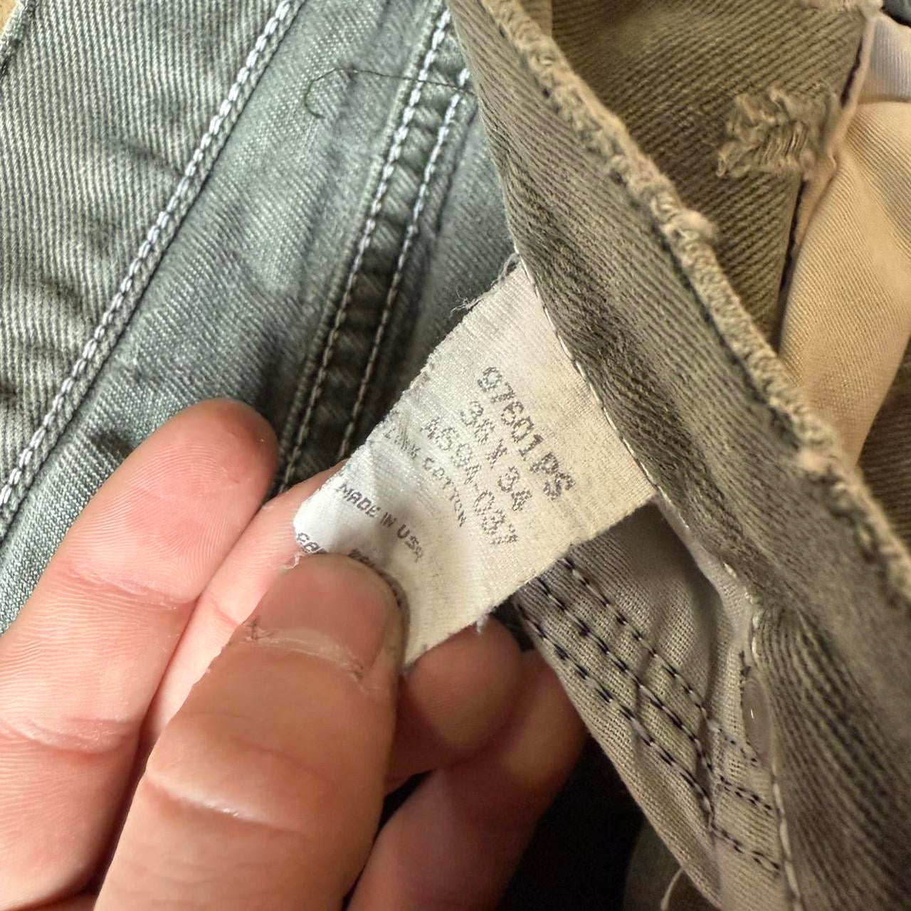Distressed Green Wrangler Jeans