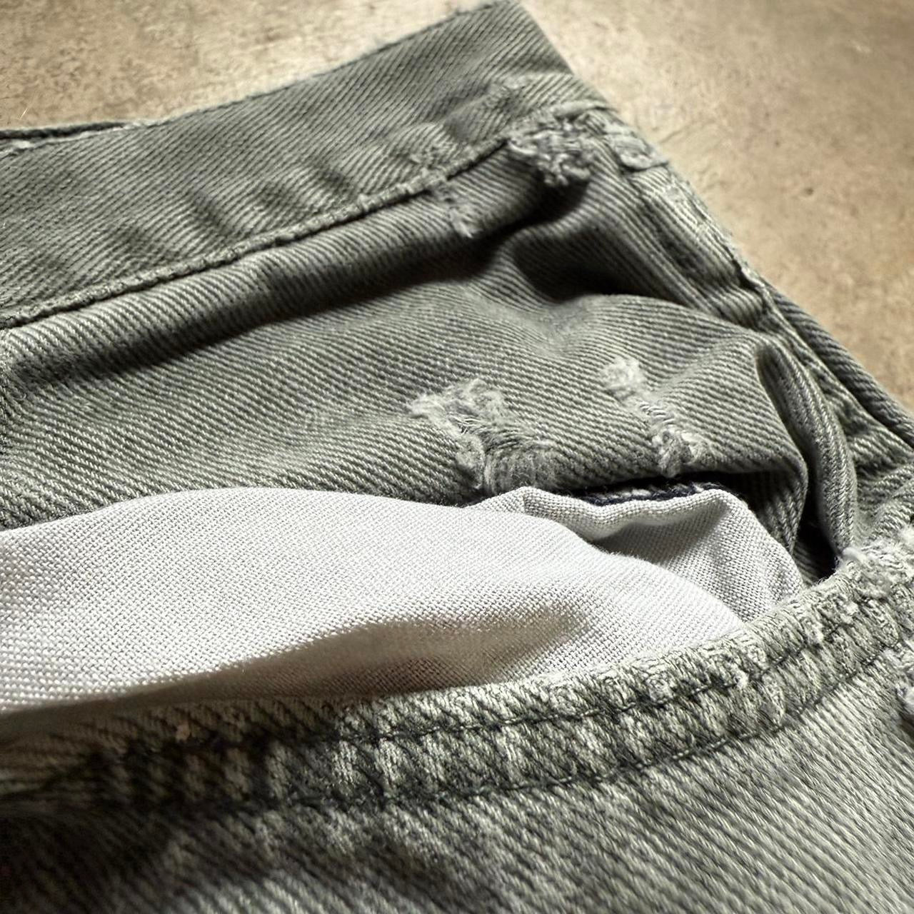 Distressed Green Wrangler Jeans
